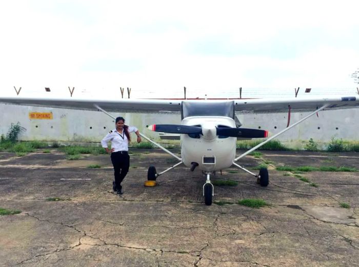 Captain Tarana Saxena stands next to a Cessna at Banasthali Vidyapith University.