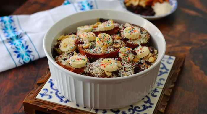 Capirotada, a traditional Mexican dessert, is a rich and spiced bread pudding flavored with cinnamon and cloves.