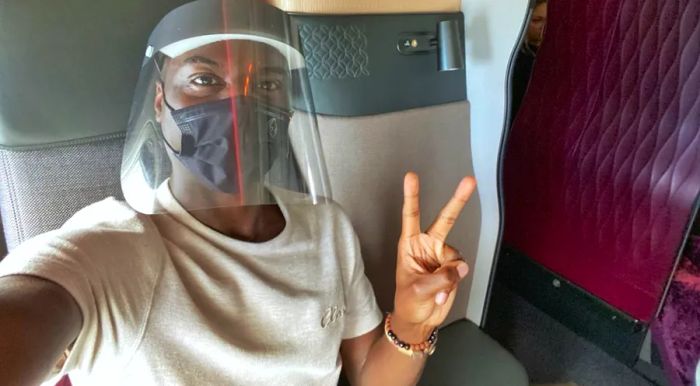 Travis Levius, a writer, flew to the Maldives with Qatar Airways, one of the few airlines still offering flights to the country. Passengers are required to wear face shields and masks when boarding.