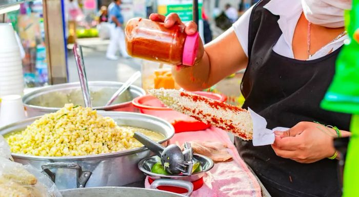 Grilled corn, a beloved snack, is a staple in many Mexican streets and markets.