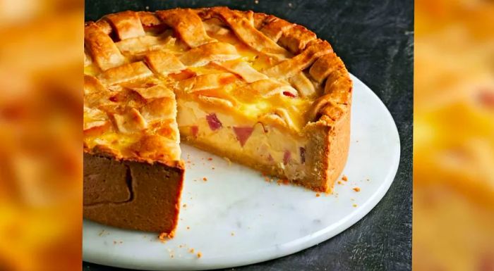 Italian pizza rustica, a savory pie stuffed with meats and cheeses, is typically served at room temperature on Easter Sunday.