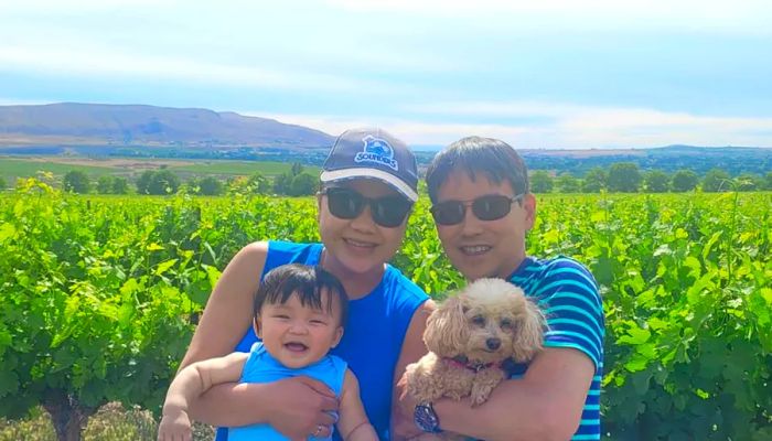 Takagi and Fortuna enjoying a recent wine tasting trip with their son Joseph and their dog Heidi.