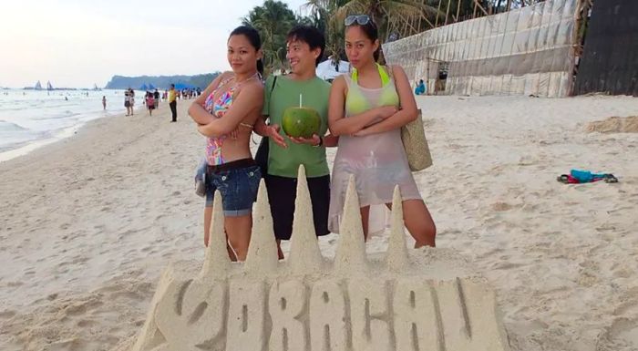 During their time in Boracay, Mae Edilyn Lumba Fortuna (left) and her friend Ivy (right) crossed paths with Jon Takagi, an American traveler.