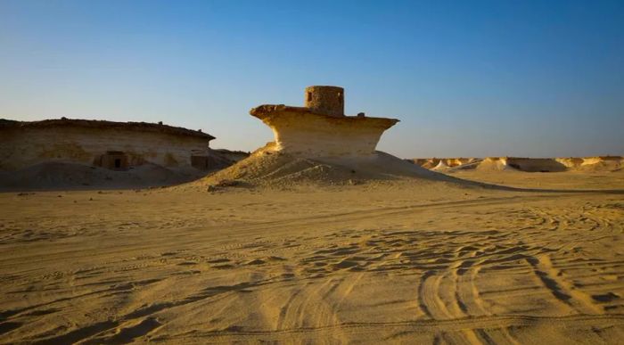 The relentless desert winds have shaped the rocks into strange and captivating forms.