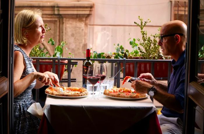 Stanley Tucci chats with Professor Elisabetta Moro about the rich history of pizza in Naples.