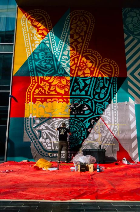 Shepard Fairey creating his inaugural mural in the Middle East in Dubai’s Design District.