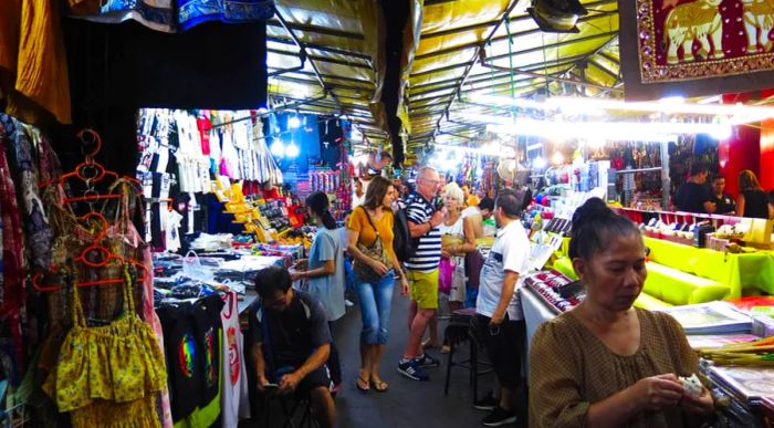 Each evening, the streets of Patpong Road are lined with vibrant outdoor stalls offering a mix of goods for passersby.