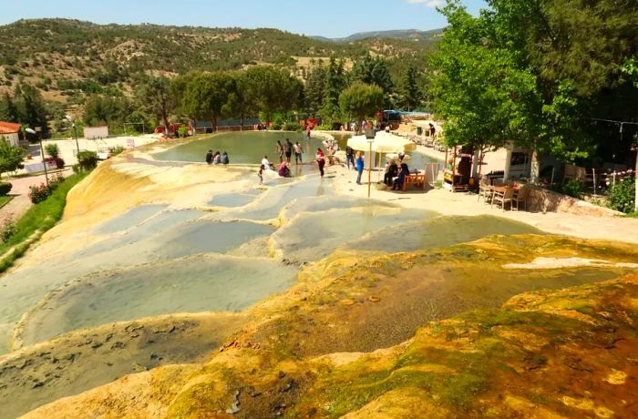 In the nearby spa town of Karahayit, geothermal springs leave behind red mineral deposits, offering another natural wonder to explore.