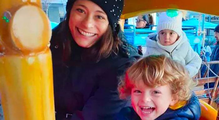 Carmelina Ciampa, pictured with her youngest son in Italy, while her husband and eldest son remain in Australia.