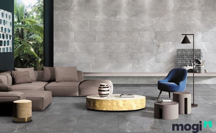 Màu xám là gam màu chủ đạo khi bạn lựa chọn phối màu gạch ốp tường phòng khách theo phong cách Industrial, tạo nên không gian mạnh mẽ nhưng cũng đầy cuốn hút.