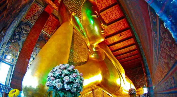 At Wat Pho, the real challenge is capturing the entire 26-meter-long Reclining Buddha in a single shot.