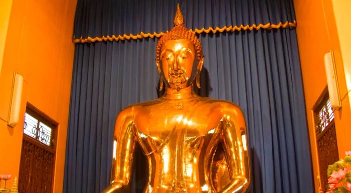 For centuries, this golden Buddha statue was concealed beneath a layer of plaster. It was only uncovered in the 1950s.