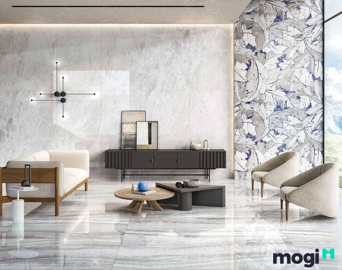 Gạch ốp tường với họa tiết vân đá sẽ tạo điểm nhấn nổi bật cho phòng khách, giúp không gian thêm phần đặc sắc.
