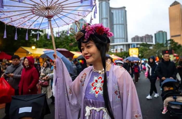 A woman dressed in Hanfu takes a stroll through the Spring Festival Flower Market in Guangzhou, China, on February 9, 2024.