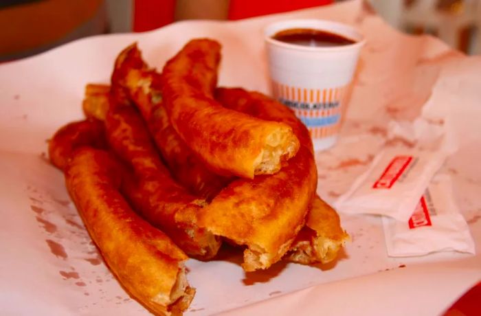 Churros: Where crispy dough meets rich chocolate for an irresistible combination.