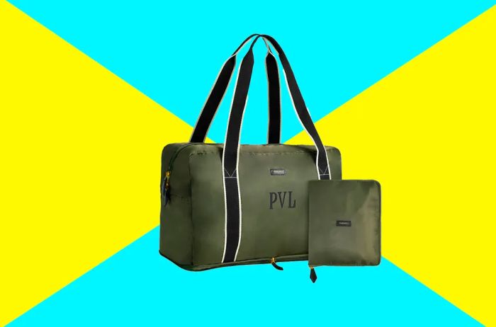 Paravel fold-up duffle bag in olive green with black handles; also shown: compact, square pouch containing the folded-up bag.