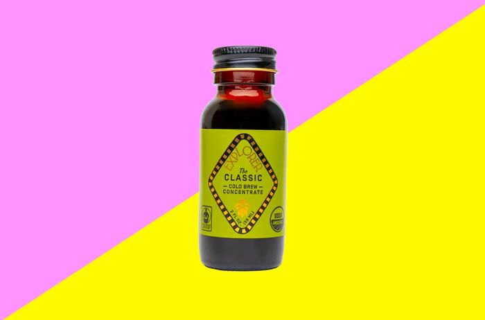A 2-ounce bottle of cold brew concentrate with a green label.