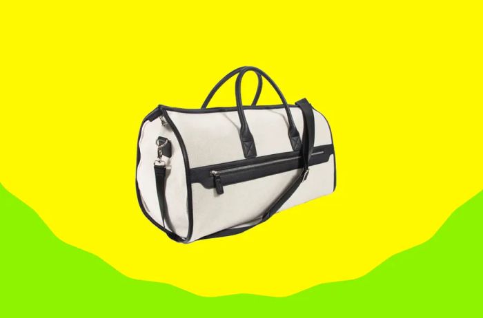 A white duffel bag with black trim and a hidden garment bag inside (not visible in the image).