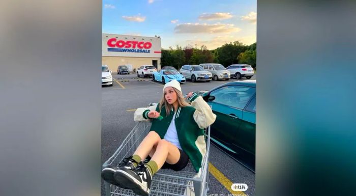 A Chinese influencer strikes a pose in the Costco parking lot in Shanghai.