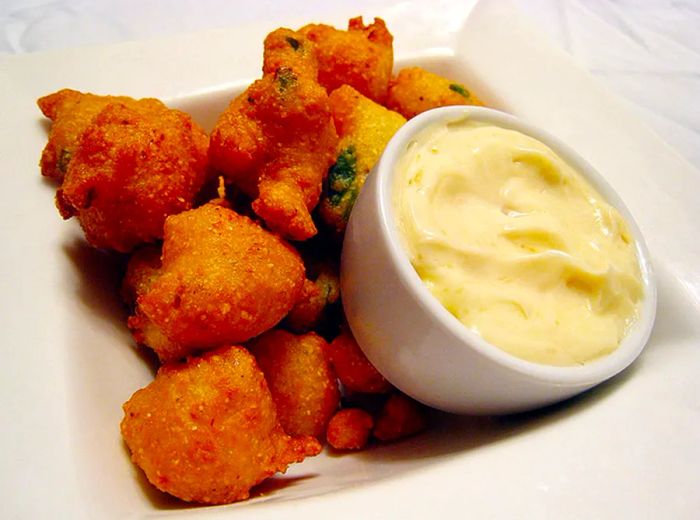 Among the creative offerings at Dirty Candy in New York are jalapeno hush puppies, a standout dish.