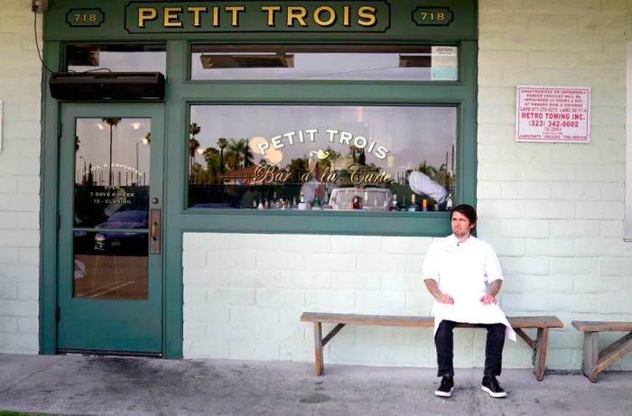 Chef Ludo stands in front of Petit Trois on Highland Avenue. The restaurant has earned a reputation for its mouthwatering omelets and classic escargot.