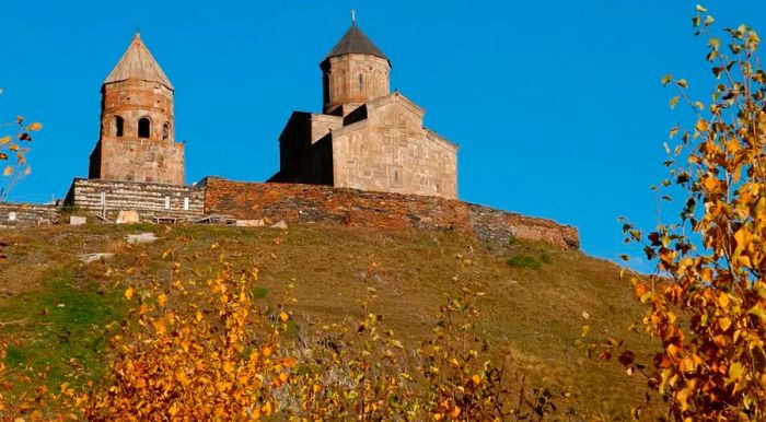 Gergeti Trinity Church stands proudly against the striking backdrop of Mount Kazbek, Europe’s fifth-highest peak.