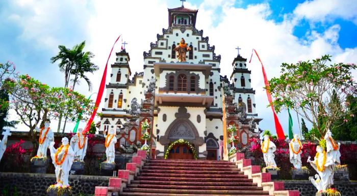 In Palasari, the Sacred Heart of Jesus Church stands proudly with an unexpectedly grand facade against the lush, steaming jungle that surrounds it.