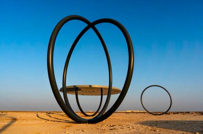 'Shadows Traveling on the Sea of the Day,' created by Olafur Eliasson, uses reflective surfaces to reinterpret the surrounding desert landscape.