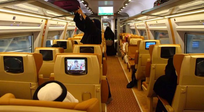 Business class passengers aboard the train can enjoy entertainment on seat-back TVs.