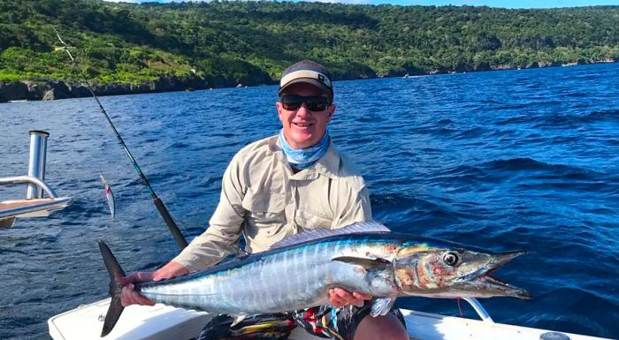 Christmas Island is a fisherman’s paradise. Lauren Taylor’s husband, Brendan, proudly shows off one of his impressive catches.