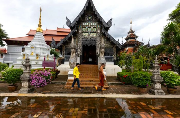 On September 9, 2021, a monk walks through the nearly deserted Wat Chedi Luang in Chiang Mai, Thailand.