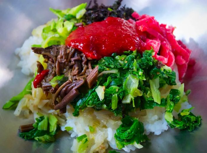 Jinju's signature bibimbap is served with 'yukhoe' – raw strips of julienned beef.