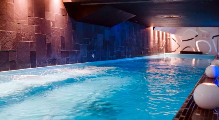 At New York Palace Spa, guests can unwind by the pool, which is uniquely designed to resemble a cave.