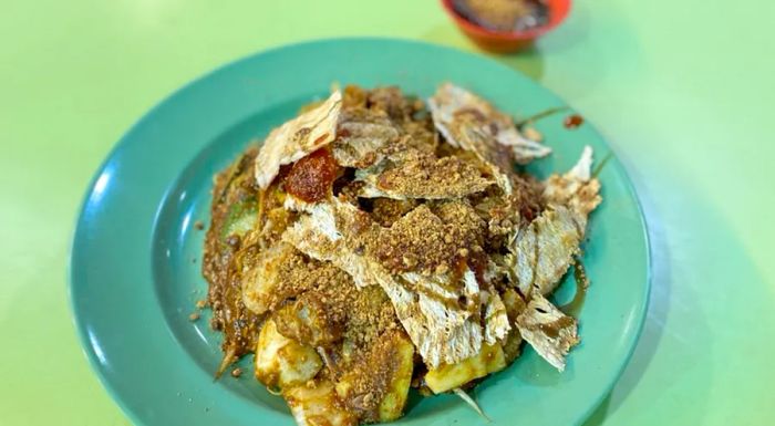 The word 'rojak' means 'mixed' in Malay, and it's a classic salad dish in Singapore.