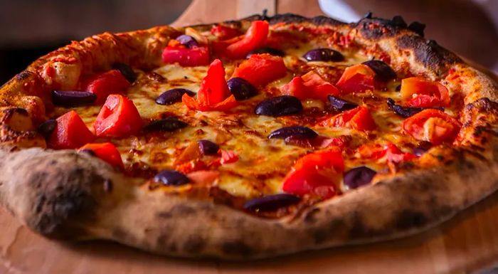 São Paulo's take on pizza often departs from traditional Italian styles, favoring generous layers of cheese and bold, unconventional toppings.