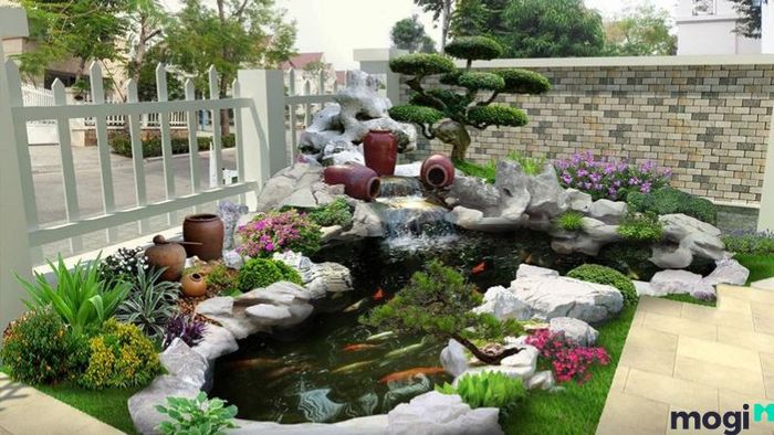 Hồ cá kết hợp cùng hòn non bộ tạo không gian sống động và hài hòa.