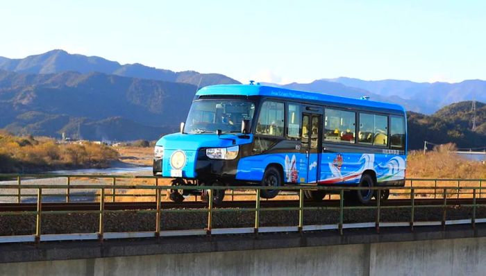 Trains or roads? Why not both? The DMV Road-Rail Bus can travel on both, making it a versatile form of transport.