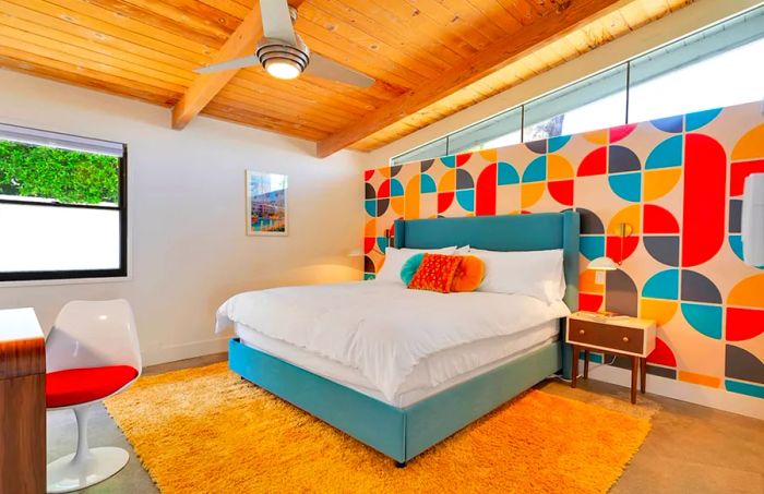 In this Twin Palms rental, midcentury wallpaper and shag carpets are part of the vintage charm.