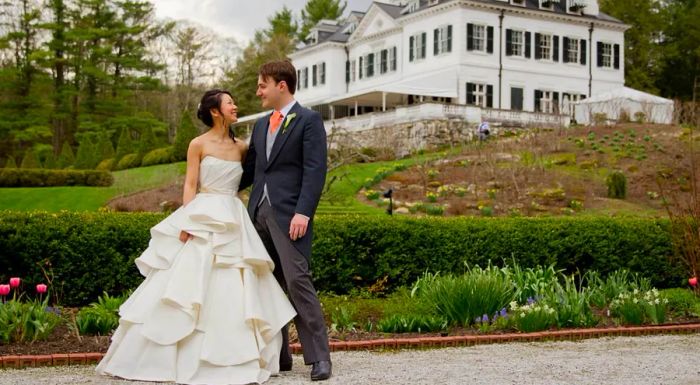 Michelle and Augustin on their wedding day in 2014, sharing a moment of pure joy.