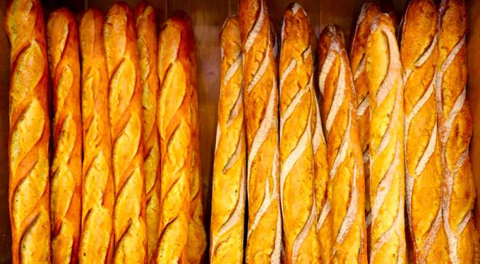 The finest baguettes aren't simply called 'baguettes.' The crème de la crème are known as 'traditions.' One such example comes from Le Grenier à Pain Abbesses, located in the Montmartre district of Paris.