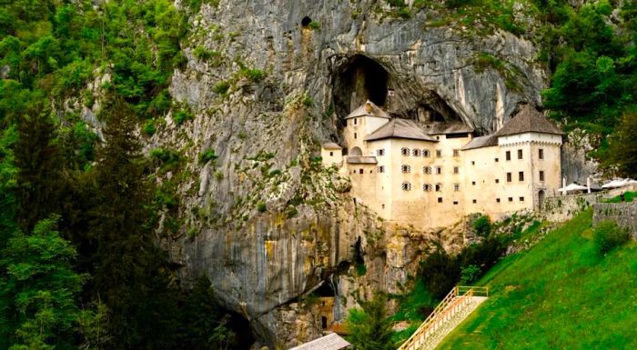 Predjama Castle is uniquely built into the entrance of a cliffside cave.