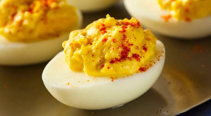 Deviled eggs are a beloved dish in both Spain and the US, often served at parties or holiday gatherings. The creamy, seasoned filling inside the halved egg whites is a favorite appetizer across many cultures.