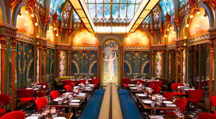 Located in a beautifully restored 19th-century atrium just off the Champs-Élysées, the Paris location of the Beefbar empire maintains its original Art Nouveau charm, featuring mirrored walls and murals of fairy goddesses.