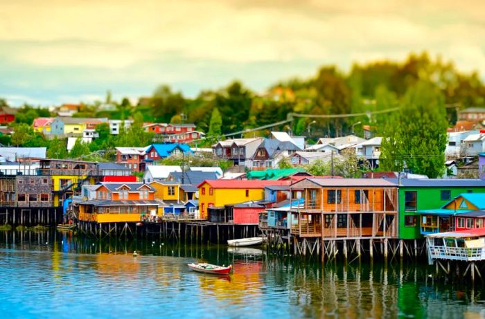 The colorful palafitos, or houses on stilts, line the waterfront in the town of Castro on the Island of Chiloé, Chile.