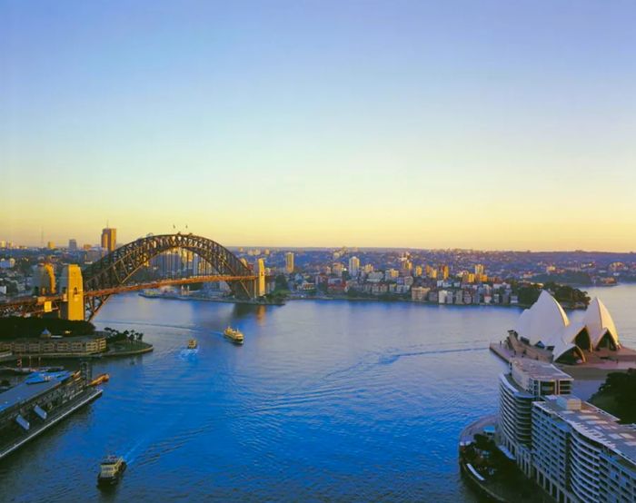 Tourists frequently enjoy boat rides around Sydney Harbour.