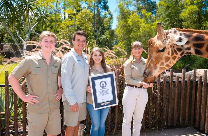 Forest, seen here with the Irwin family, has sired 12 calves during his time at the zoo.