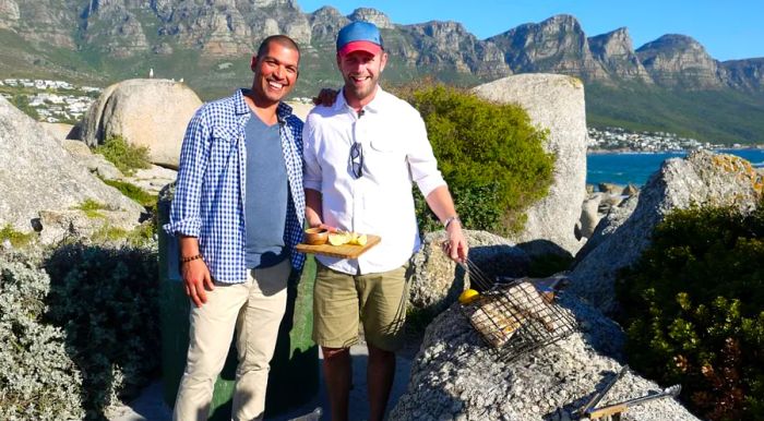 Riffel meets Jan Scannell, the founder of South Africa's Braai Day, while filming the show 