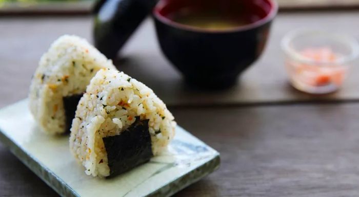 Triangle-shaped onigiri is a classic snack commonly found in bento boxes.