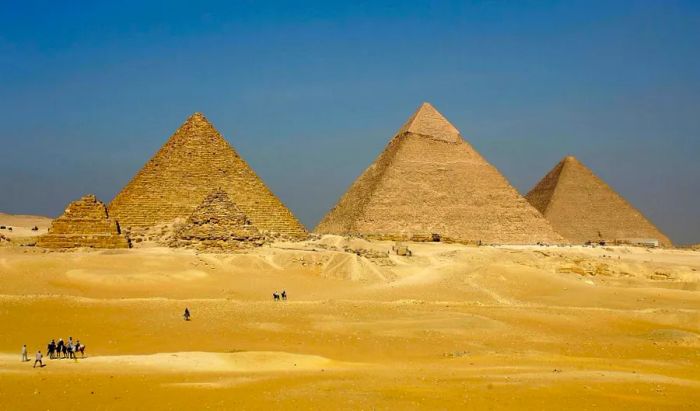 Three towering pyramids dominate the skyline at Giza.