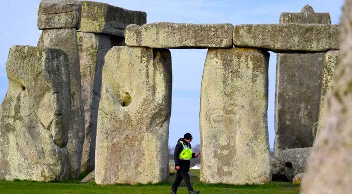 A security guard stands watch around the closed Stonehenge during last year’s spring equinox.